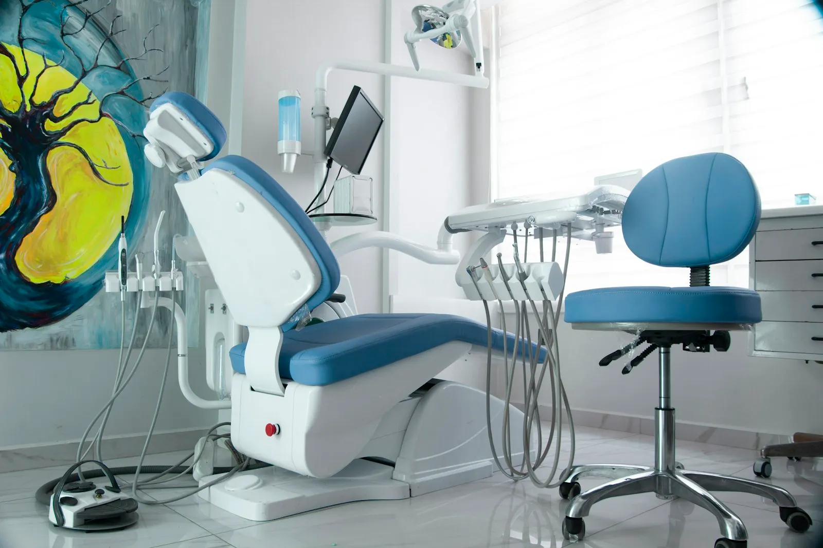 A bright, modern dental treatment room prepared for a patient